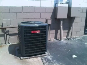 Goodman air conditioning unit installed outside a commercial building, part of a professional AC installation service.
