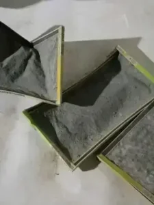 Three dirty air filters with heavy dust buildup after three months of use, displayed on a light-colored surface.