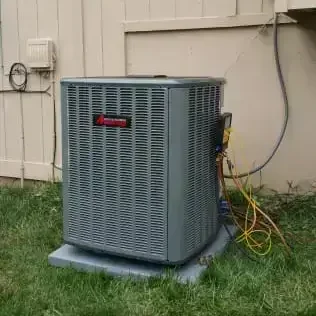 Newly installed Amana air conditioning unit outside a residential home, part of professional HVAC upgrade service.